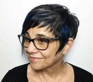 Hairstyle in black with blue highlights.